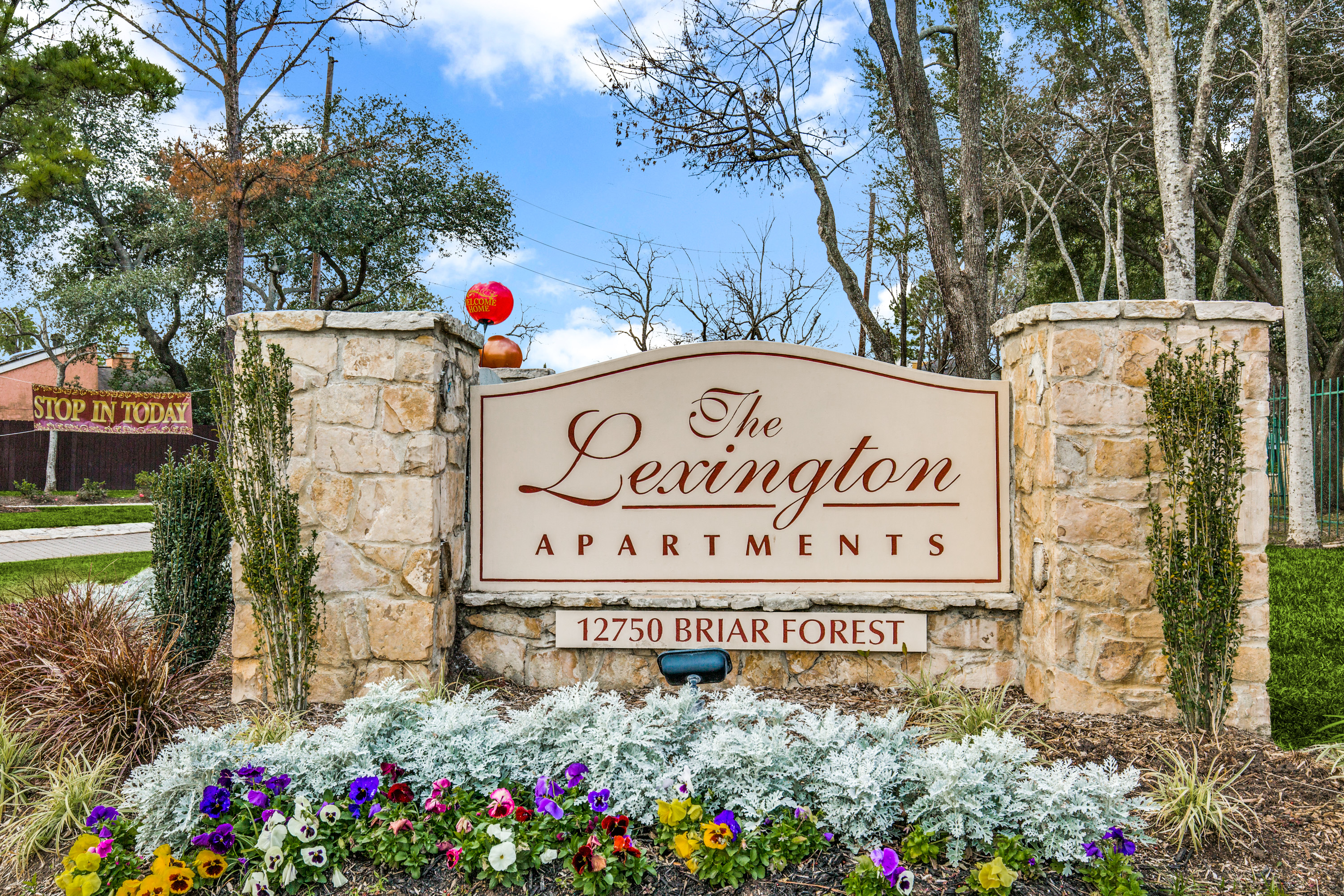 The Lexington sign with joyful flowers.