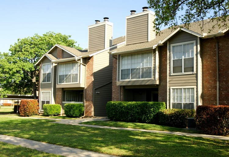 Cozy living apartment building with green landscaping