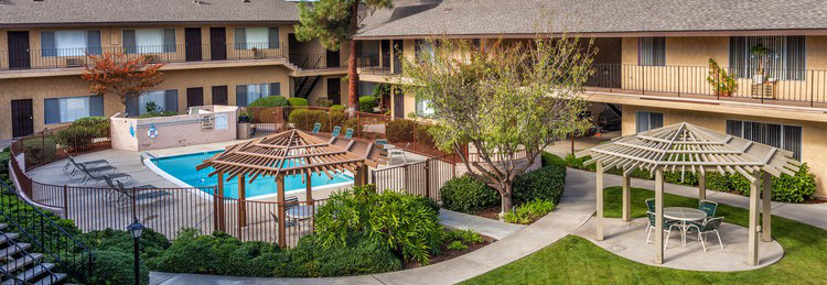 Lovely landscape surrounding fresh pool.