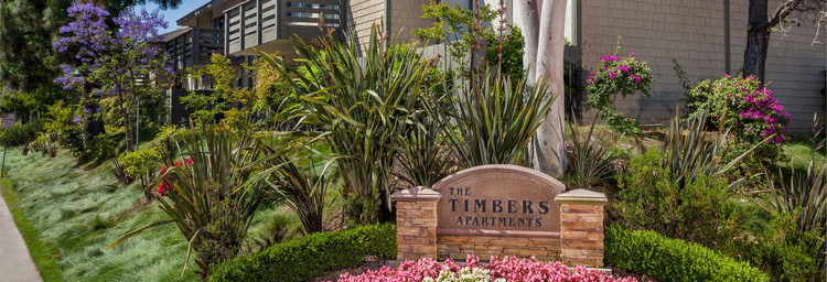 Property monument sign with beautiful flowers.